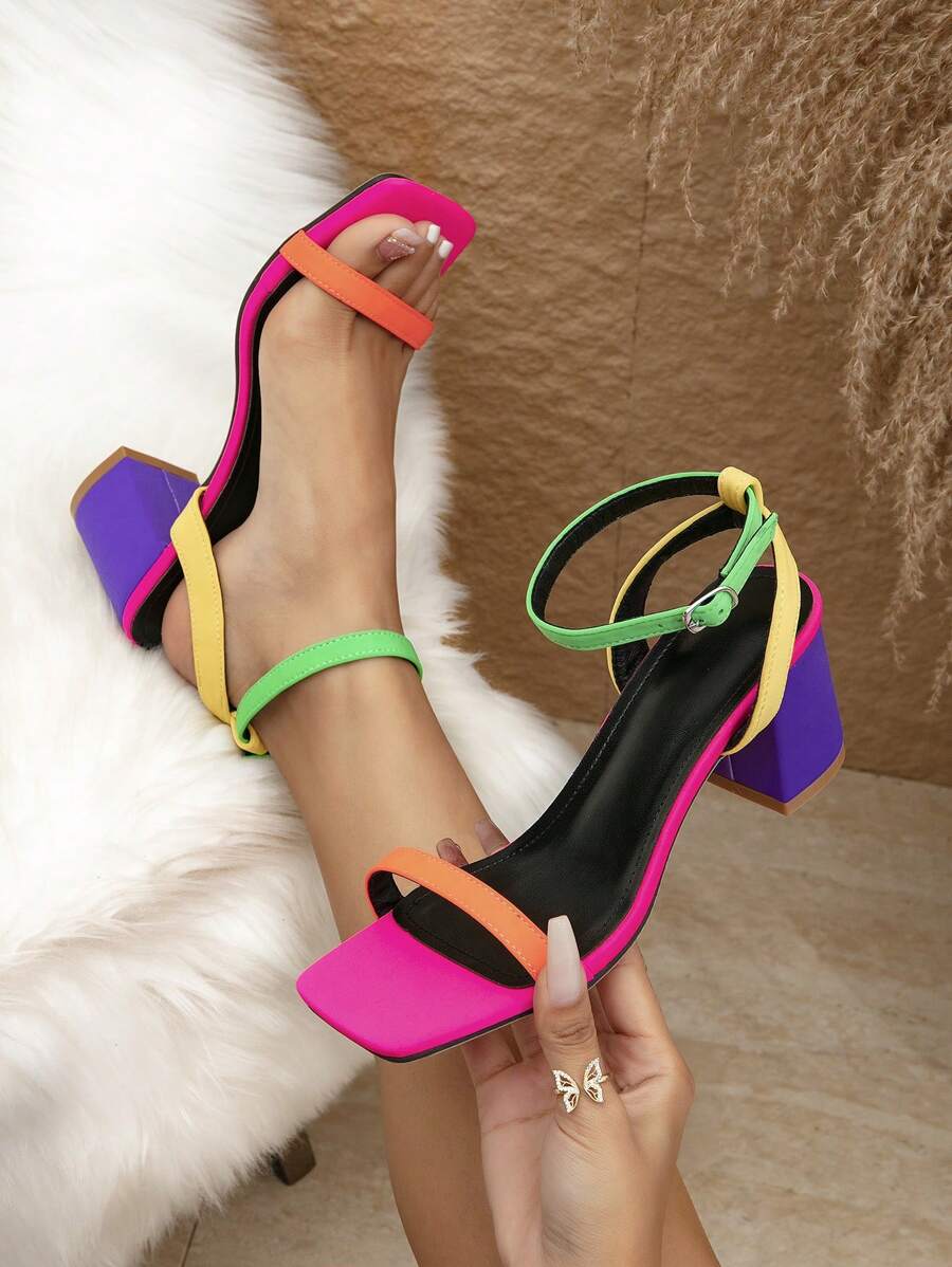 Color-block ankle-strap sandals with hot pink square toes orange toe straps green ankle straps yellow side straps and purple block heels