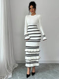 Black and white striped knit midi sweater dress with tiered ruffle hem, front view