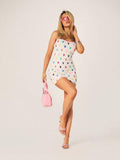 Hop into summer style with this playful mini cami dress featuring a vibrant colorful bunny print. The delicate pink binding adds a charming finishing touch that elevates the fun design. Perfect for warm-weather gatherings, beach days, and casual outdoor celebrations, this dress combines whimsical charm with effortless wearability. The fitted cami silhouette flatters while keeping you cool and comfortable. 
