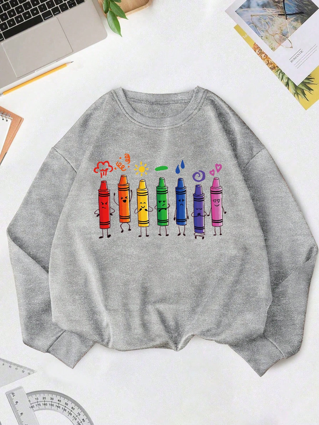 The Colorful Crayon Print Sweatshirt is the perfect casual wear for Teachers' Day. Show off your artistic side with the vibrant and fun crayon print, while staying comfortable and stylish. Made from high-quality materials, this sweatshirt is perfect for any teacher looking for a unique and playful addition to their wardrobe.