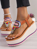 These Colorful Patchwork Wedge Heeled Sandals are the ultimate summer must-have. With a unique patchwork design, these sandals will add a pop of color to any outfit. Not only are they stylish, but they also provide extra height and support with a comfortable wedge heel. Perfect for any summer occasion.