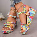 Multicolor wedge sandals rear view showing ankle buckle slingback support and printed wedge