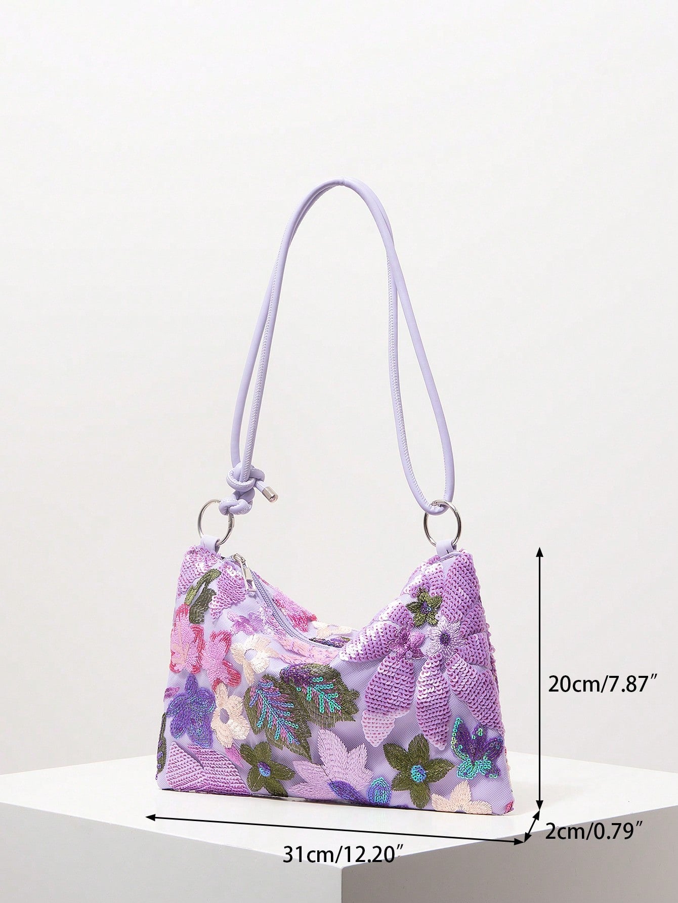 Add a splash of sparkle to your special night with this Colorful Sequin Floral Shoulder Bag. Perfect for prom or weddings, its vibrant sequins and floral design bring playful elegance to any outfit. Lightweight and easy to carry, it’s the ideal accessory to keep your essentials close while turning heads with every step.