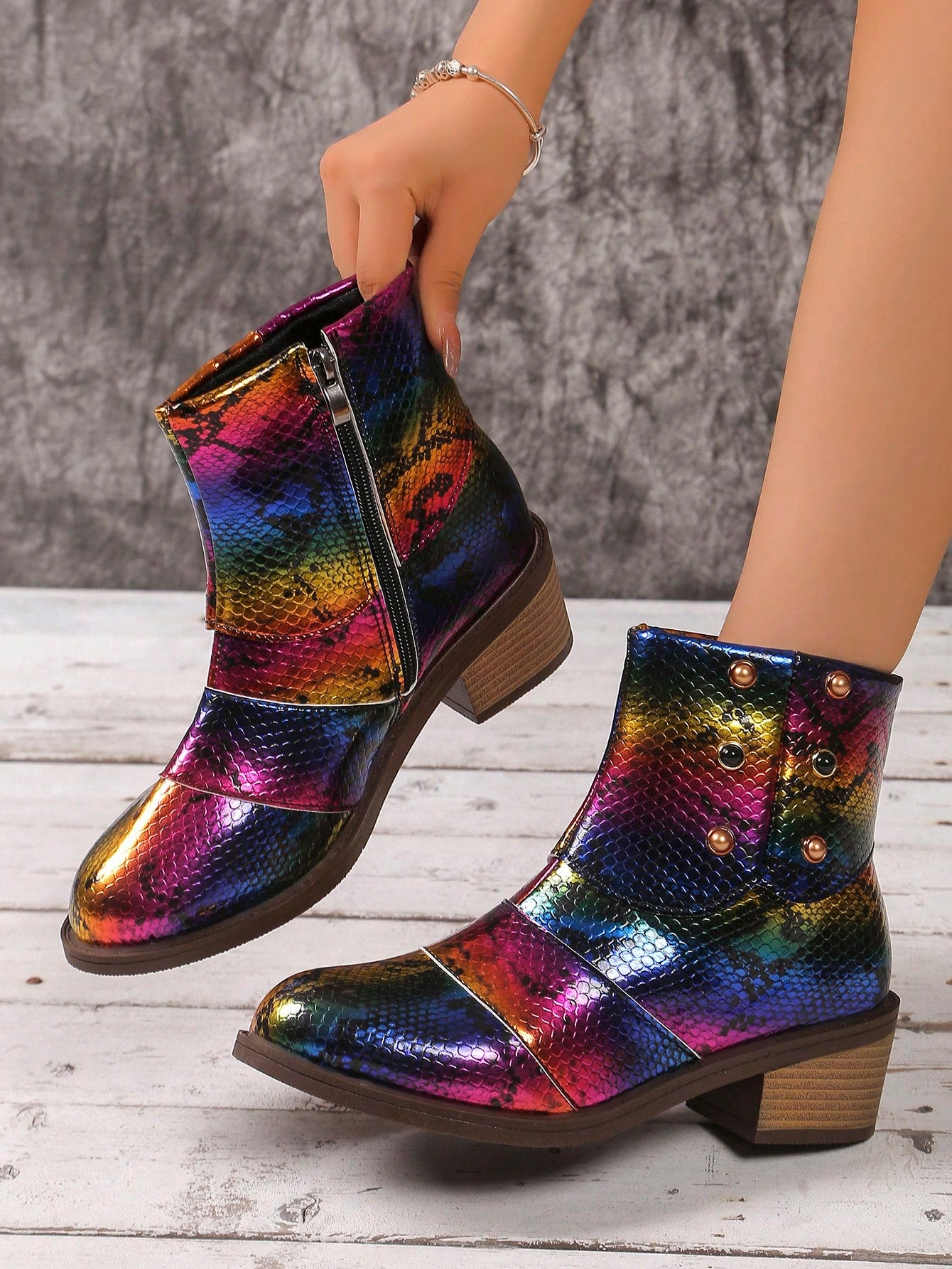Introduce some unique style to your wardrobe with our Colorful Snake Pattern Chunky Heel Ankle Boots. With vibrant colors and a trendy snake pattern, these boots will make you stand out in any crowd. Their chunky heel provides both comfort and stability, making them the perfect choice for a night out on the town. Show off your fashion sense with these stylish ankle boots.