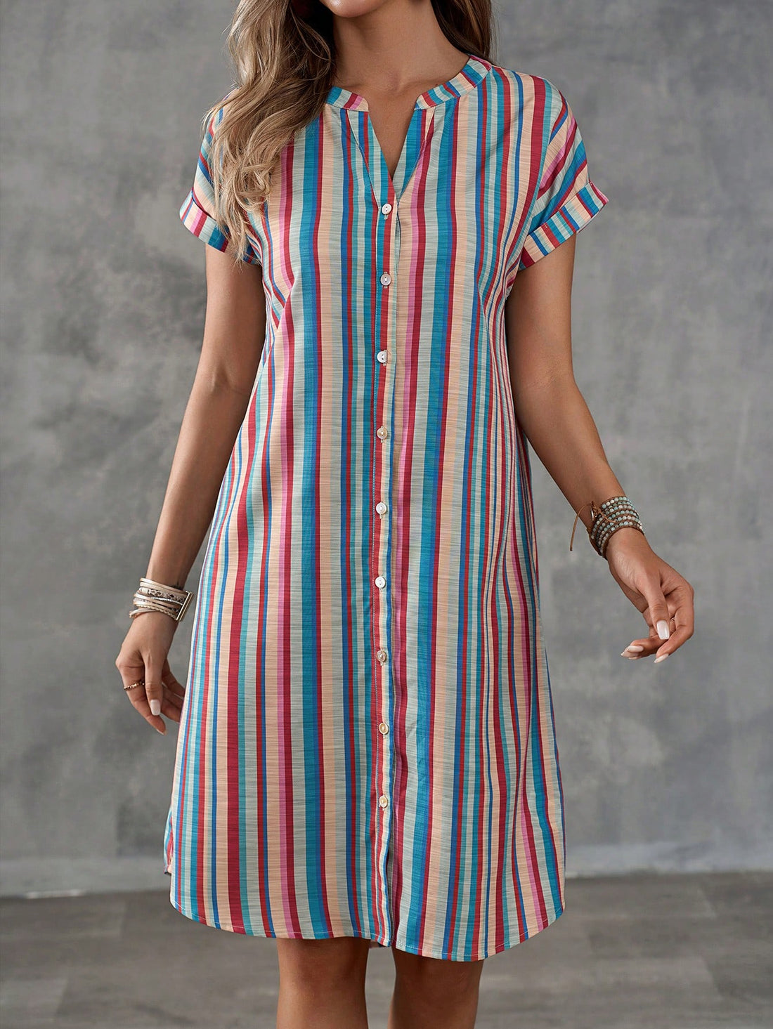 Get ready for some summer fun in our Colorful Striped Notched Neck Summer Dress! With a button front and playful, colorful stripes, this dress is perfect for casual holidays. Stay comfortable and stylish all season long in this must-have dress!