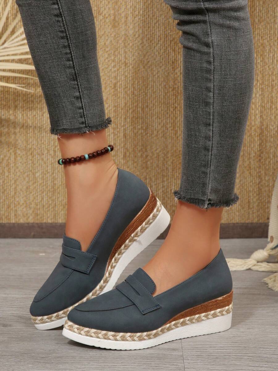 Step into effortless style with these women's wedge heel loafers—the perfect blend of comfort and casual cool. Featuring a supportive thick sole and slip-on design, they're ideal for everything from weekend adventures to laid-back days around town. The wedge heel adds just the right lift without sacrificing comfort, while the durable construction keeps up with your active lifestyle. Whether you're heading outdoors or keeping it casual, these loafers deliver the comfort you crave with the style you'll love s