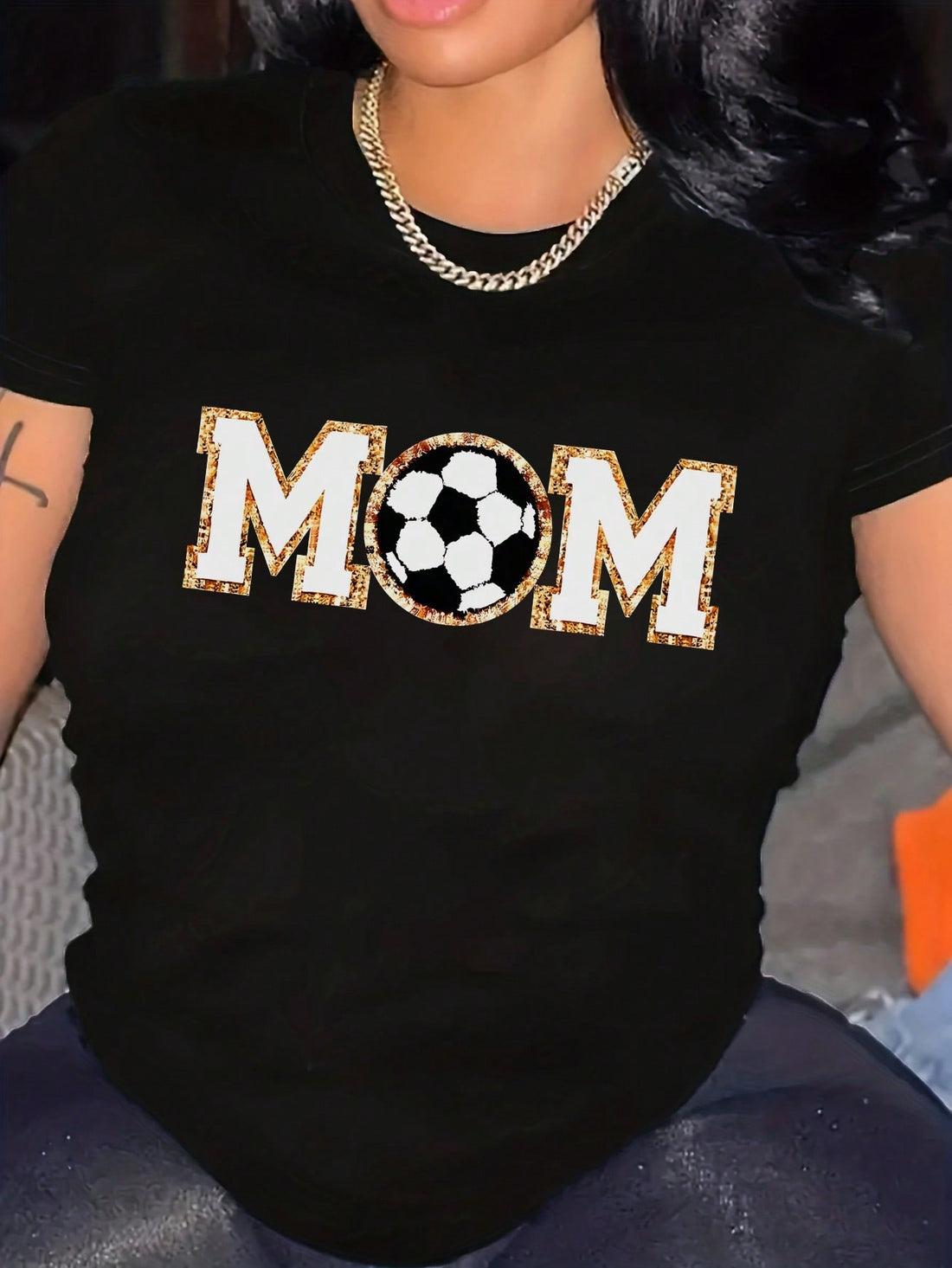 This cool and casual 'Soccer Mom' graphic tee is perfect for those hot summer days on the sidelines. With a playful design and comfortable fit, you'll be the envy of all the other moms. Show off your quirky sense of humor and love for the game with this fun and stylish shirt!