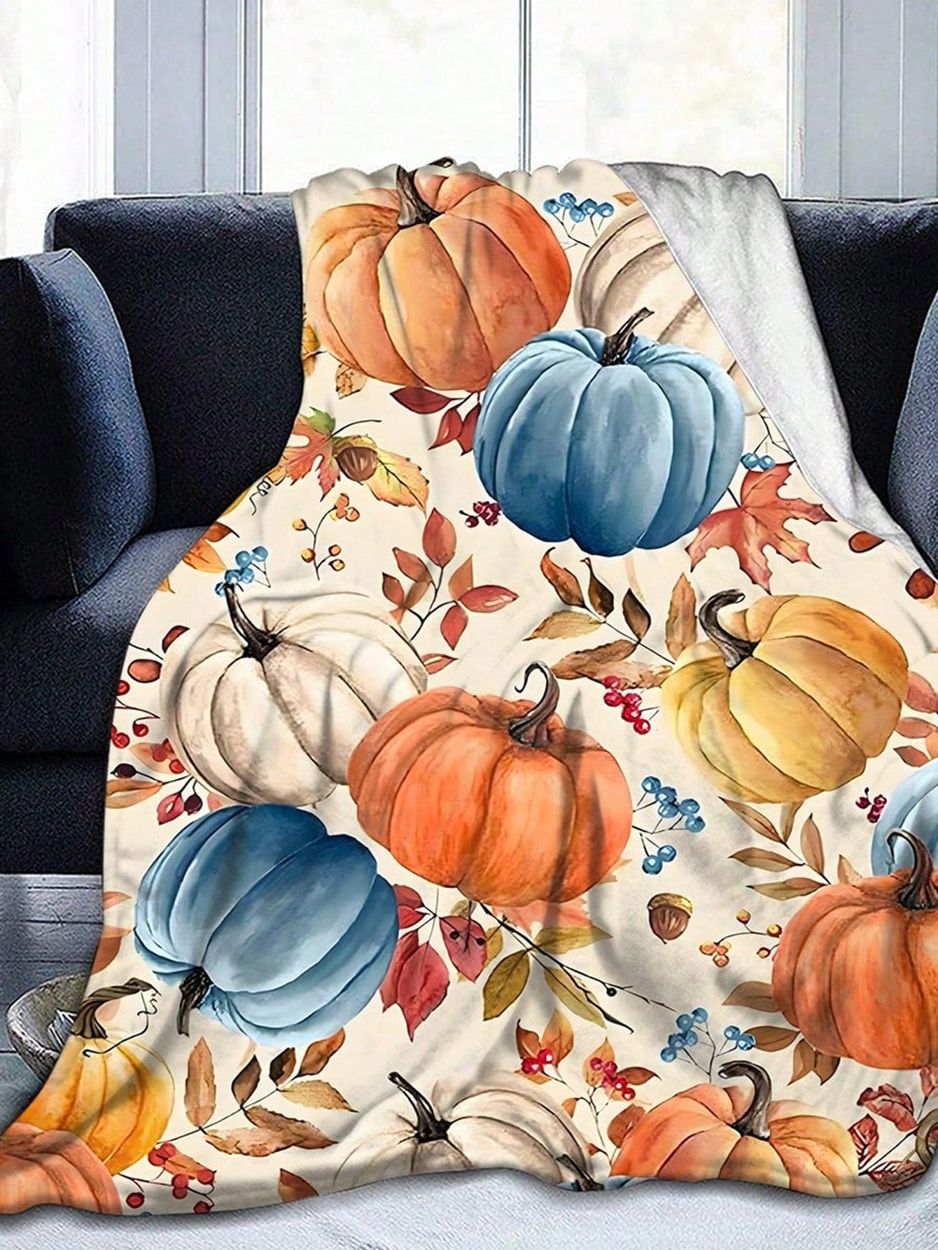 Wrap yourself in cozy autumn vibes all year long with this soft flannel pumpkin throw blanket. Perfect for all seasons, this quirky and playful addition to your home will bring warmth and smiles. Get ready to snuggle up in style!