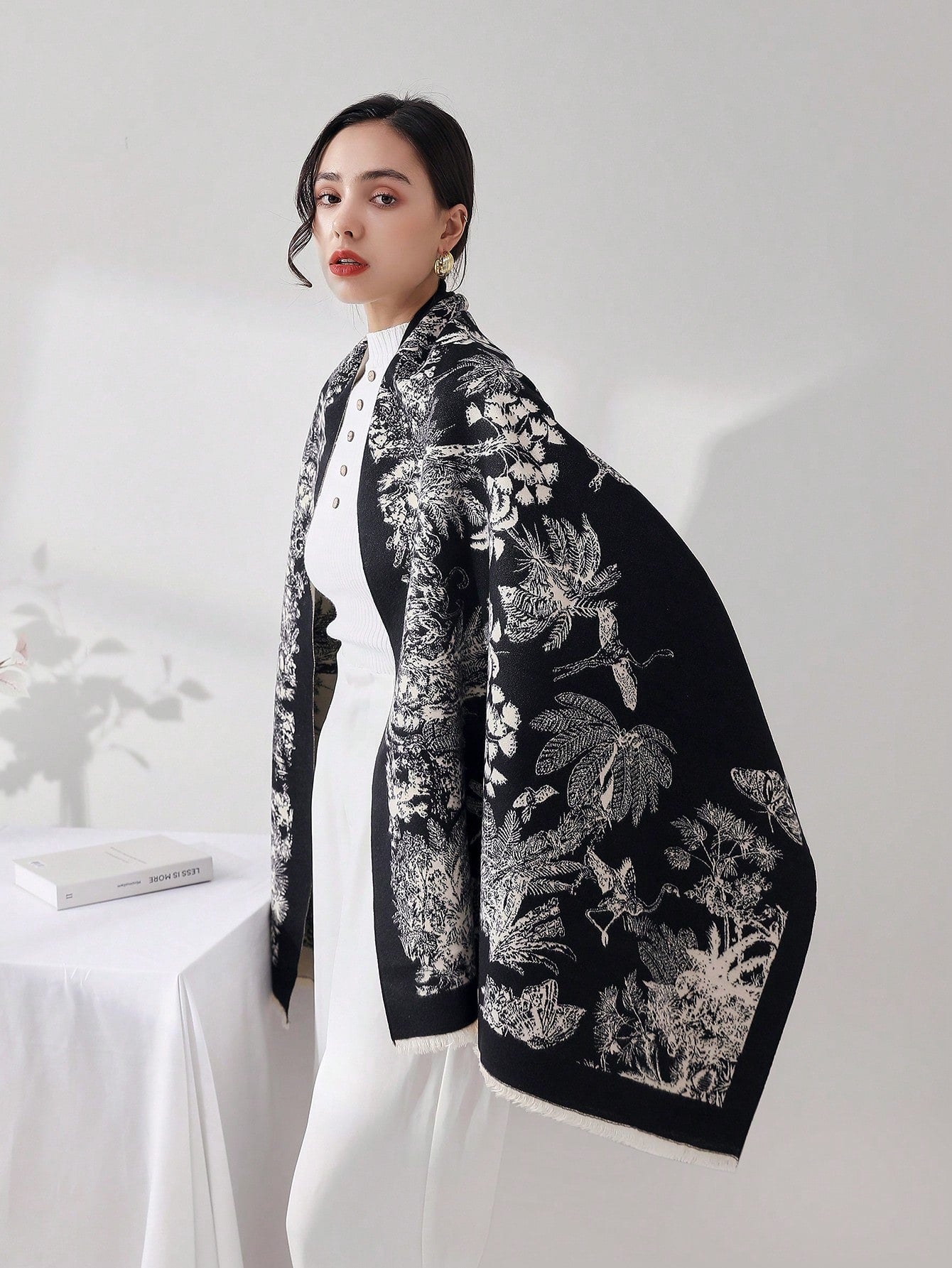 Stay stylish and comfortable with our Cozy Black Floral Retro Tasseled Blanket Scarf. Made for everyday use, this scarf will keep you warm and add a touch of retro elegance to your outfit. With its floral design and tasseled edges, this scarf is the perfect accessory for any occasion.