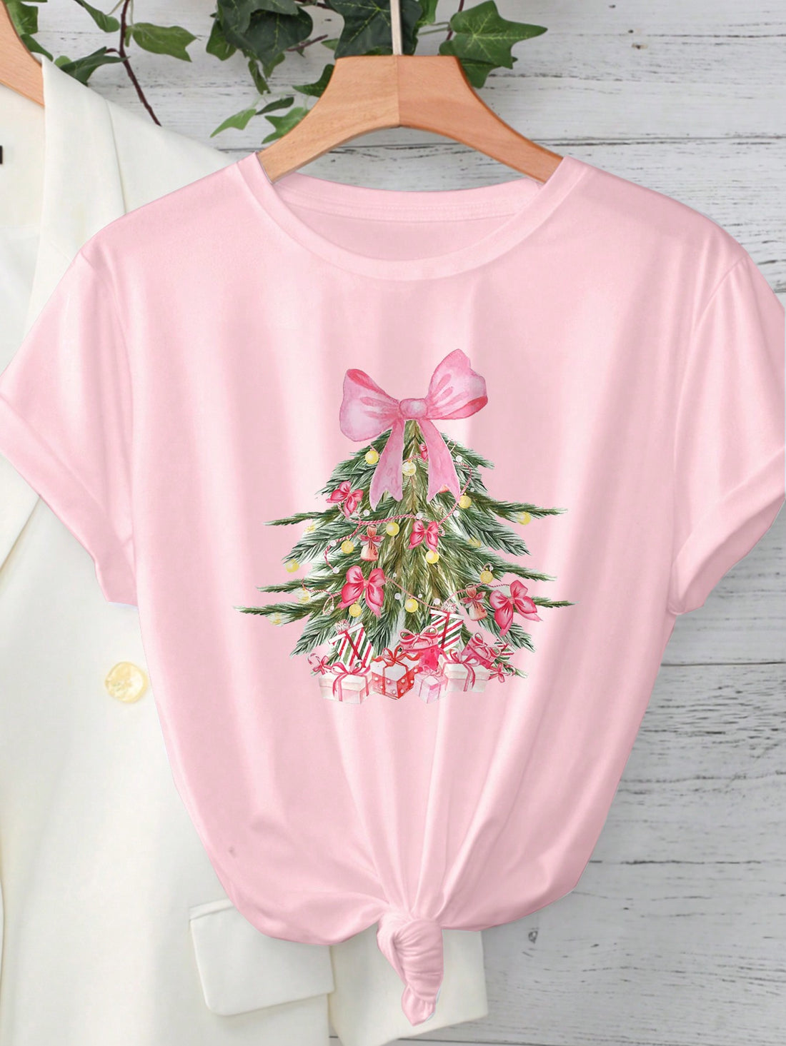 Stay stylish and comfortable with our Cozy Casual Christmas Print Round Neck T-Shirt. Its festive design is perfect for the holiday season, while its soft fabric ensures maximum comfort. Upgrade your holiday wear with this must-have piece.