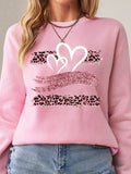 Stay warm and stylish this autumn with Cozy Chic's Heart & Leopard Print Sweatshirt. Made with soft, cozy fabric, this sweatshirt effortlessly combines comfort with fashion. The heart and leopard print design adds a touch of playfulness to your wardrobe. Experience effortless style and comfort with Cozy Chic.