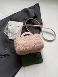 Get ready to add a touch of vintage charm to your autumn and winter look with our Cozy Chic handbag! Crafted from fluffy wool, this box-shaped bag exudes a cozy and chic vibe. Perfect for keeping your essentials close and adding a unique touch to your style. (Vintage never looked so chic!)
