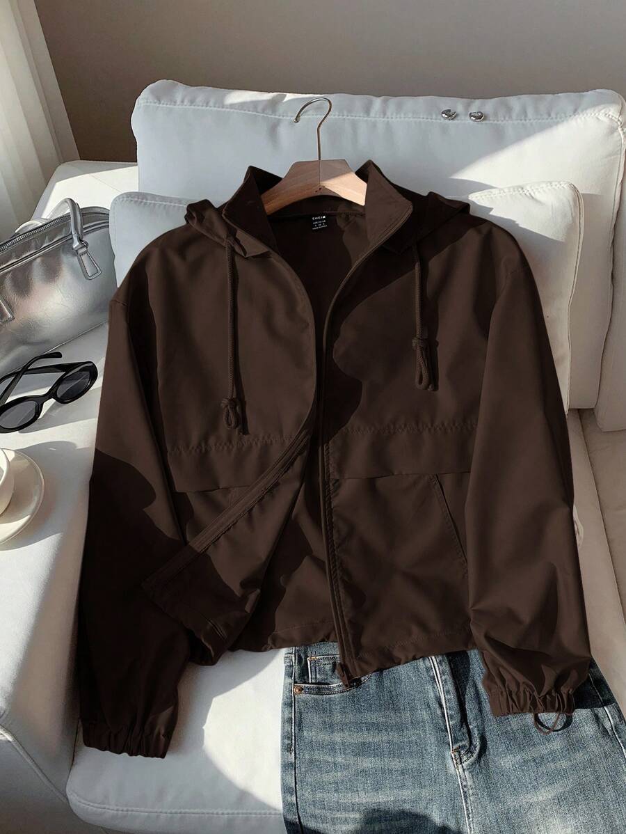 Wrap yourself in warmth and style with this cozy coffee brown cropped jacket. Designed for fall and winter layering, this zip-up hoodie combines comfort with practical sun protection. The cropped silhouette flatters your frame while the soft fabric keeps you snug during cooler months. Perfect for casual outings, weekend adventures, or relaxed days at home. Layer it over your favorite tee or wear it solo for effortless, on-trend appeal.