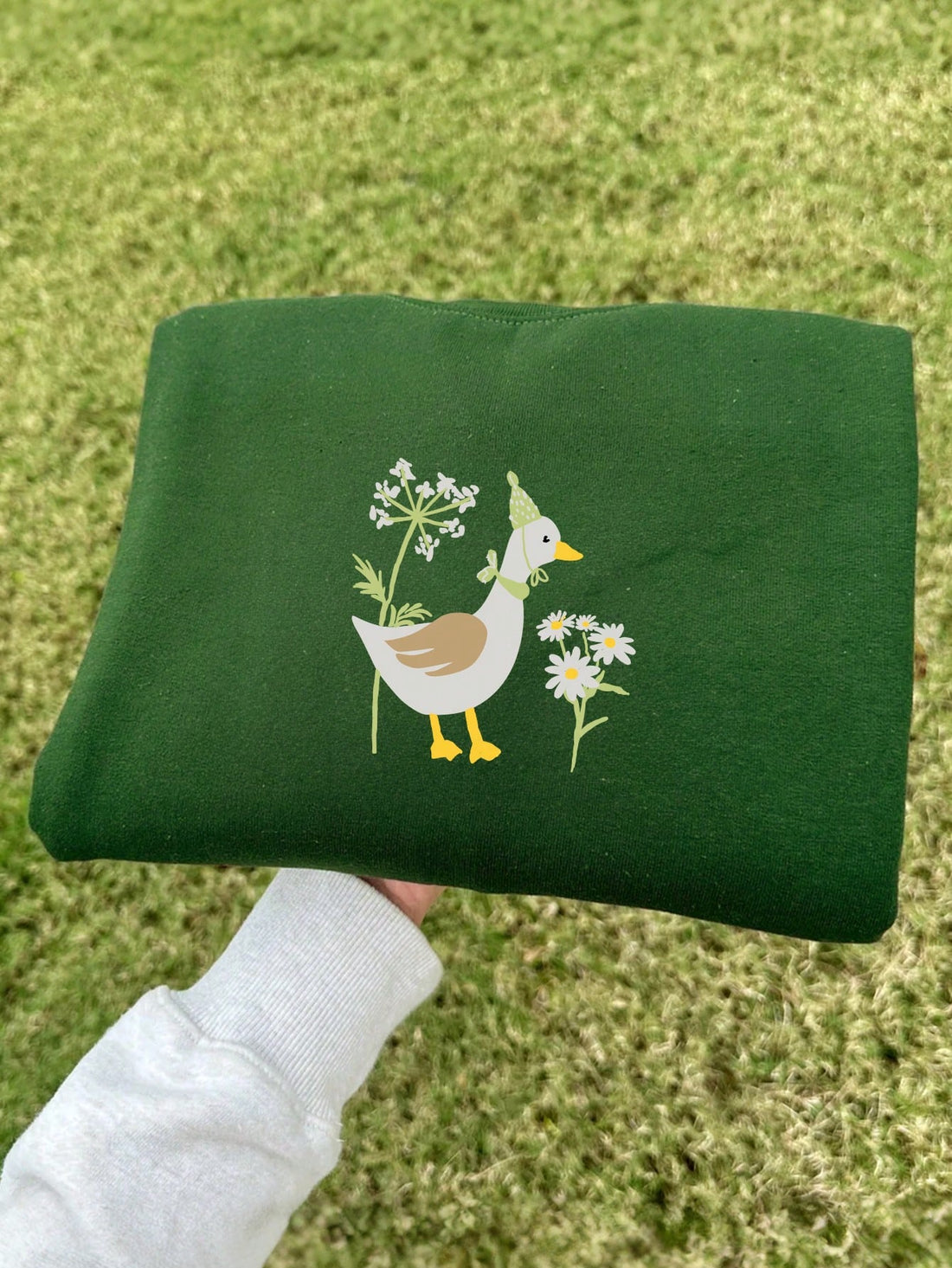 Stay warm and stylish this autumn and winter season with our Cozy Daisy Duck Print Crew Neck Sweatshirt. Made with soft materials, this sweatshirt features a cute and vibrant Daisy Duck print that will surely brighten up your day. Perfect for staying cozy while making a statement.