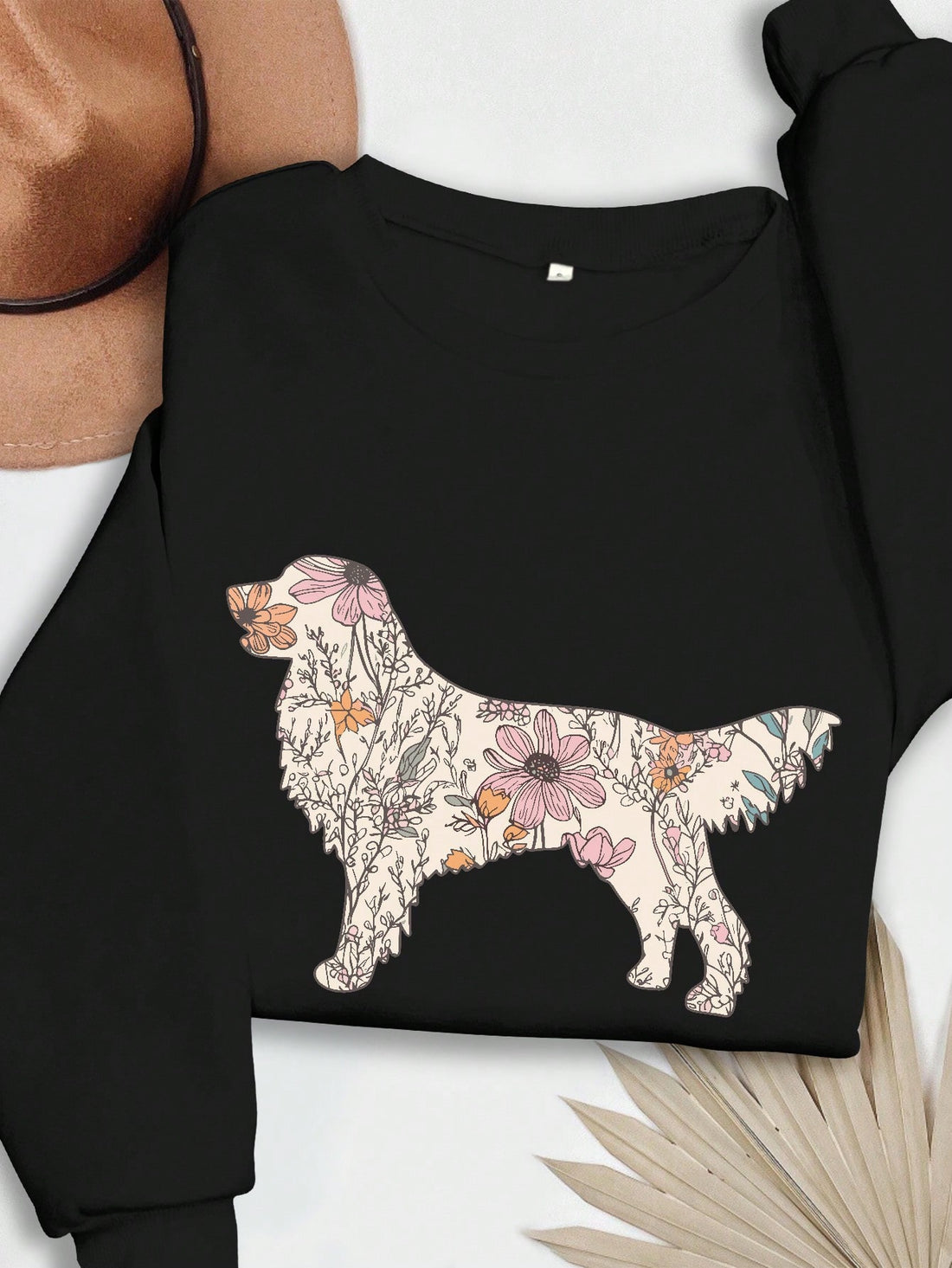 Experience ultimate comfort and fun with our Cozy Floral Dog Graphic Sweatshirt. The casual loose fit allows for free movement while the soft fabric keeps you warm and cozy. Plus, the adorable dog graphic adds a playful touch to your wardrobe. Perfect for any casual occasion.