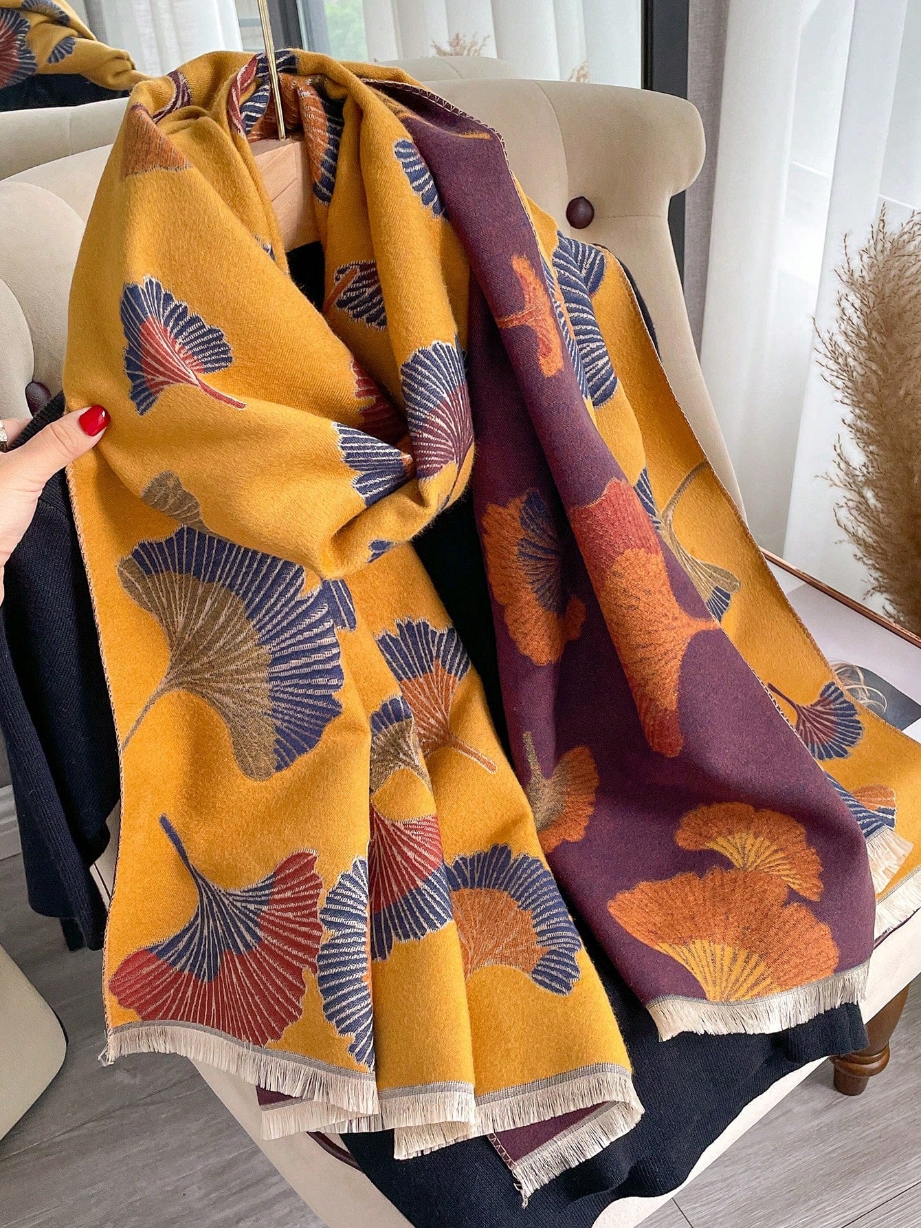 Introducing the Cozy Ginkgo Leaf Jacquard Scarf - the perfect accessory for a stylish autumn and winter look. Made of warm faux cashmere, this scarf features a beautiful jacquard pattern of ginkgo leaves. Stay cozy and fashionable this season with our stylish scarf.