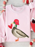 Stay cozy all season long with our Cozy Heart Duck Graphic Sweatshirt! With a loose fit, this versatile sweatshirt is perfect for autumn and winter. The adorable duck graphic adds a playful touch to any outfit. Stay snug (and stylish) with our sweatshirt!