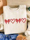 Love is in the air with our Cozy Love sweatshirt! Featuring a charming bow and heart print, this Valentine's Day sweatshirt will keep you warm and stylish. Perfect for a cozy date night or a casual day out with your special someone. Share the love and spread smiles with this playful and unique sweatshirt.