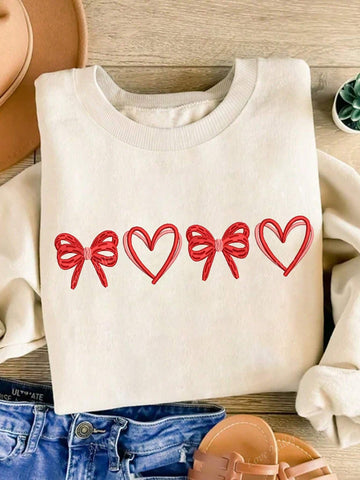 Love is in the air with our Cozy Love sweatshirt! Featuring a charming bow and heart print, this Valentine's Day sweatshirt will keep you warm and stylish. Perfect for a cozy date night or a casual day out with your special someone. Share the love and spread smiles with this playful and unique sweatshirt.