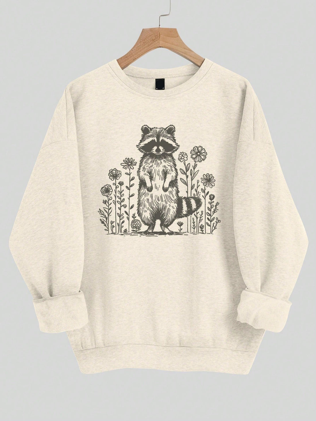 This Cozy Raccoon Floral Sweatshirt is the perfect addition to your spring and autumn wardrobe. With its casual and loose fit, it provides both comfort and style. The cute raccoon floral design adds a touch of playfulness to your outfit. Stay cozy and fashionable with this must-have sweatshirt.