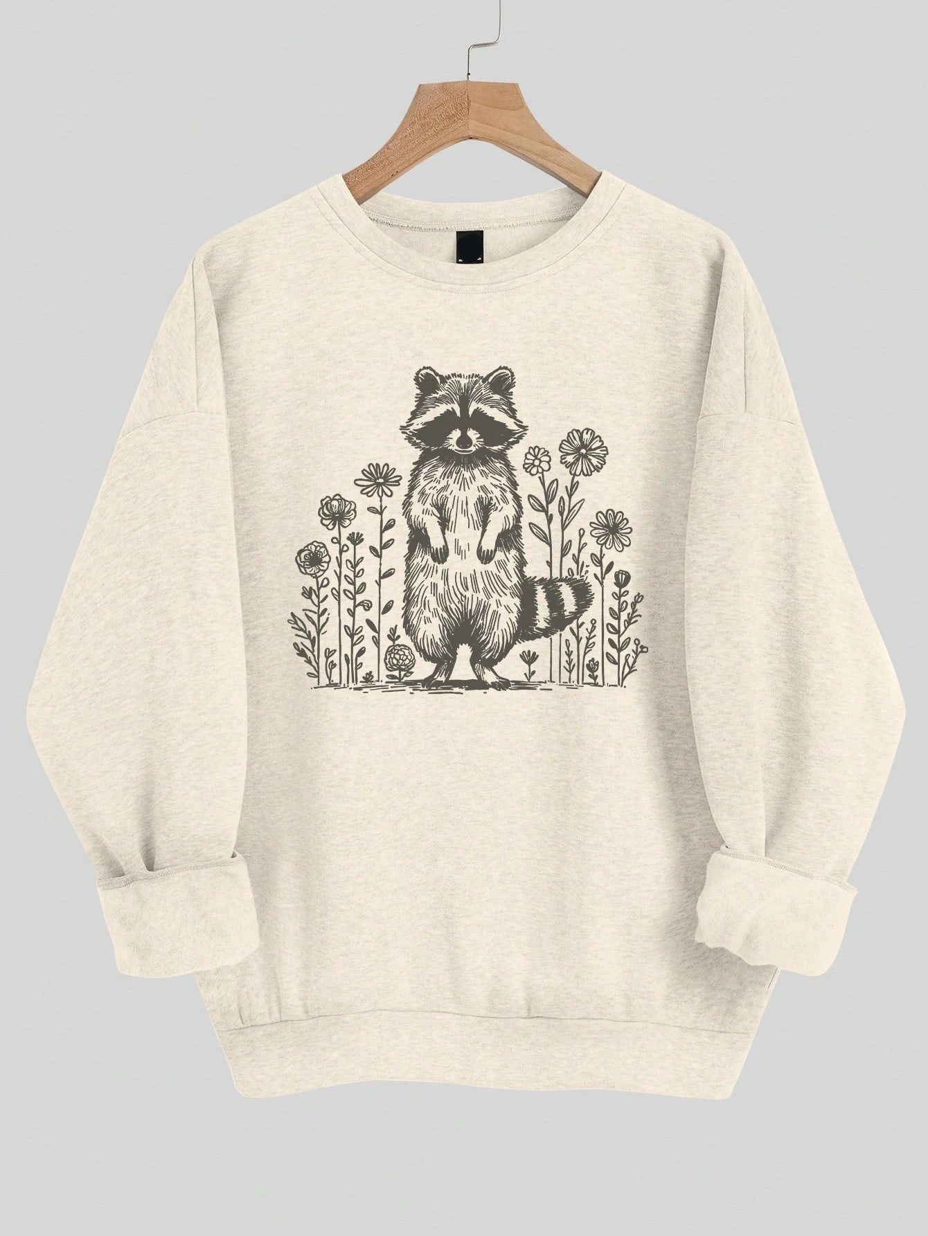 This Cozy Raccoon Floral Sweatshirt is the perfect addition to your spring and autumn wardrobe. With its casual and loose fit, it provides both comfort and style. The cute raccoon floral design adds a touch of playfulness to your outfit. Stay cozy and fashionable with this must-have sweatshirt.
