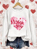 Get cozy in our Valentine's Heart Print Hoodie Sweatshirt. Perfect for chilly autumn and winter months, this hoodie will keep you warm and stylish. The heart print adds a touch of romance while the hoodie provides extra comfort. Show off your love for both fashion and Valentine's Day with this must-have sweatshirt.