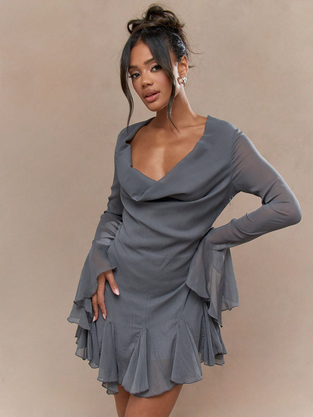 Feel flirty and fun in our Crinkle Chiffon Cowl Neck Mini Dress! With a playful cowl neck and frilly details on the sleeves and hem, this dress is perfect for a night out. Made from lightweight crinkle chiffon, it's both stylish and comfortable. (Plus, no ironing required!)