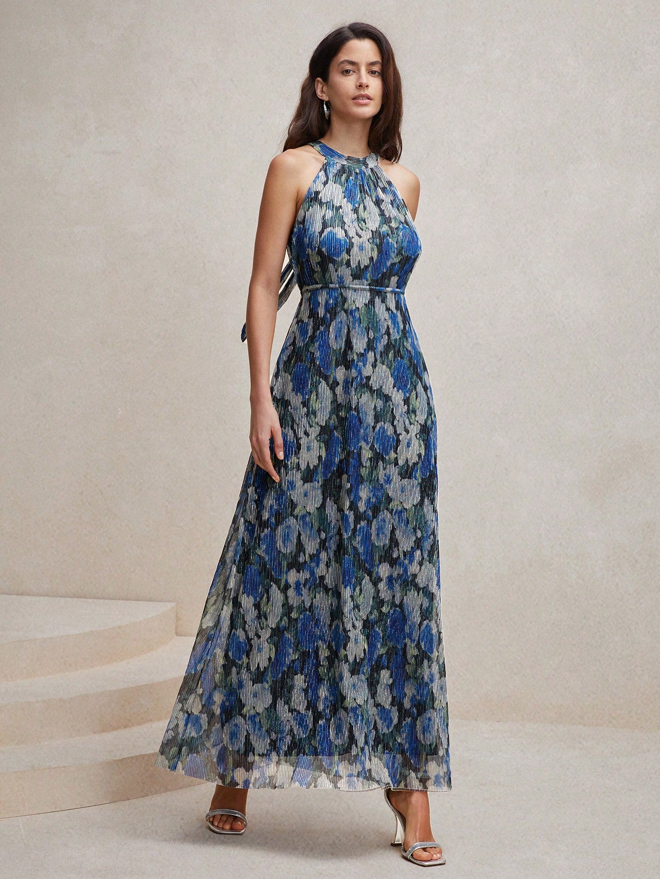 Float into summer with our Crinkled Blue Floral Print Halter Neck Maxi Dress - a must-have for your chic summer wardrobe. The halter neck adds a touch of elegance while the crinkled fabric keeps it effortlessly cool. Perfect for any summer occasion. (Summer never looked so good!)