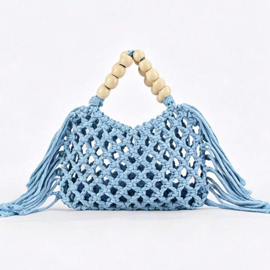 Light blue crochet mesh beach handbag with beige wooden bead handles open top and long tassel fringe on both sides