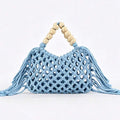 Light blue crochet mesh beach handbag with beige wooden bead handles open top and long tassel fringe on both sides