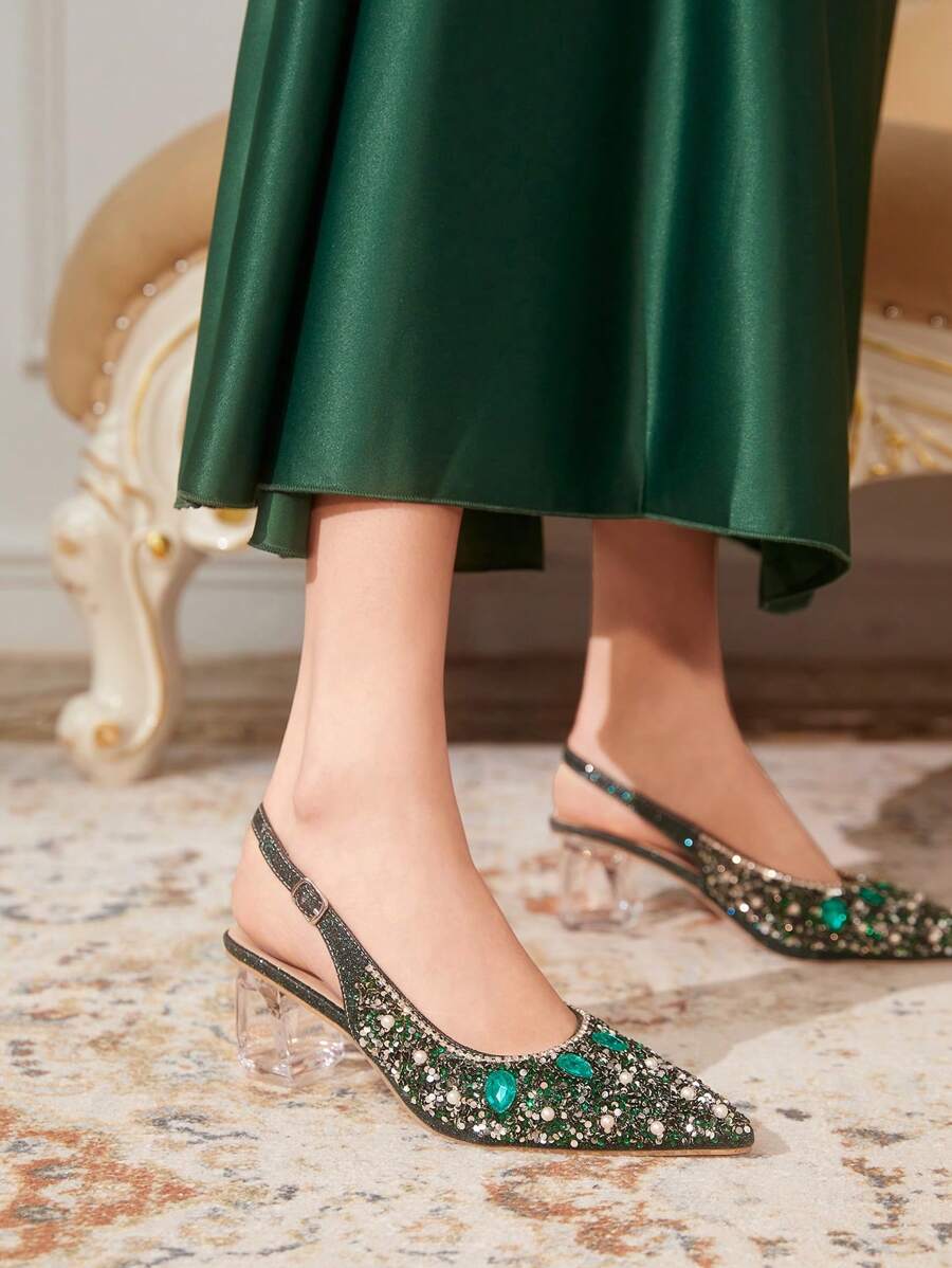 Green crystal heel pointed toe slingback pumps on-foot side view with rhinestones and pearl accents