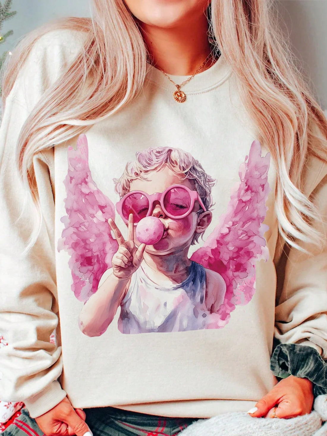 Spread the love with our Cupid Love sweatshirt for Valentine's Day. This cozy sweatshirt, adorned with a cute cupid design, is perfect for love birds looking to stay warm and stylish. It's the perfect gift for your significant other or yourself (because self-love is important too)!