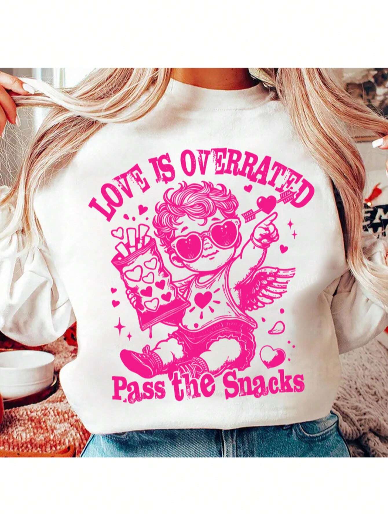 Add a touch of charm to your Valentine's Day wardrobe with Cupid's Charm sweatshirt. Featuring a playful graphic design, this sweatshirt is perfect for showing off your holiday spirit. Stay cozy and stylish all season long!