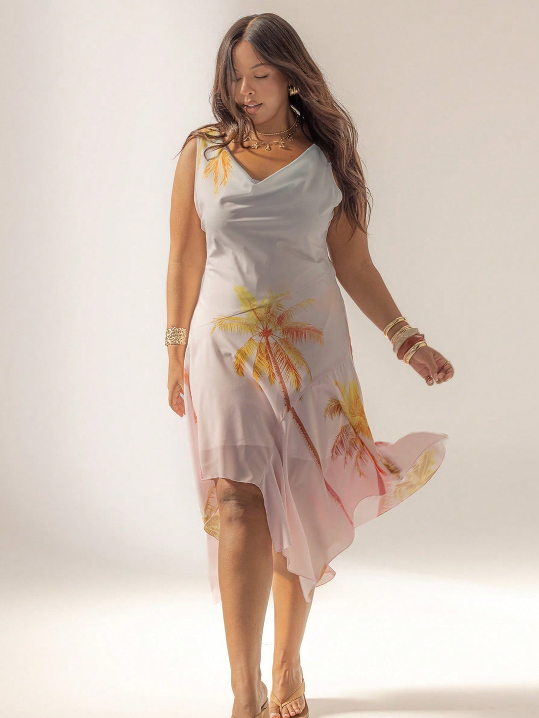 Turn heads on your beach getaway with this Curve Cowl Neck Maxi Dress. Its playful asymmetrical hem flows beautifully with every breeze, while the cowl neck adds a flirty touch. Easy to dress up or down, it’s the perfect companion for sunny days and balmy nights by the shore. Comfortable, stylish, and effortlessly chic—your new vacation favorite awaits!