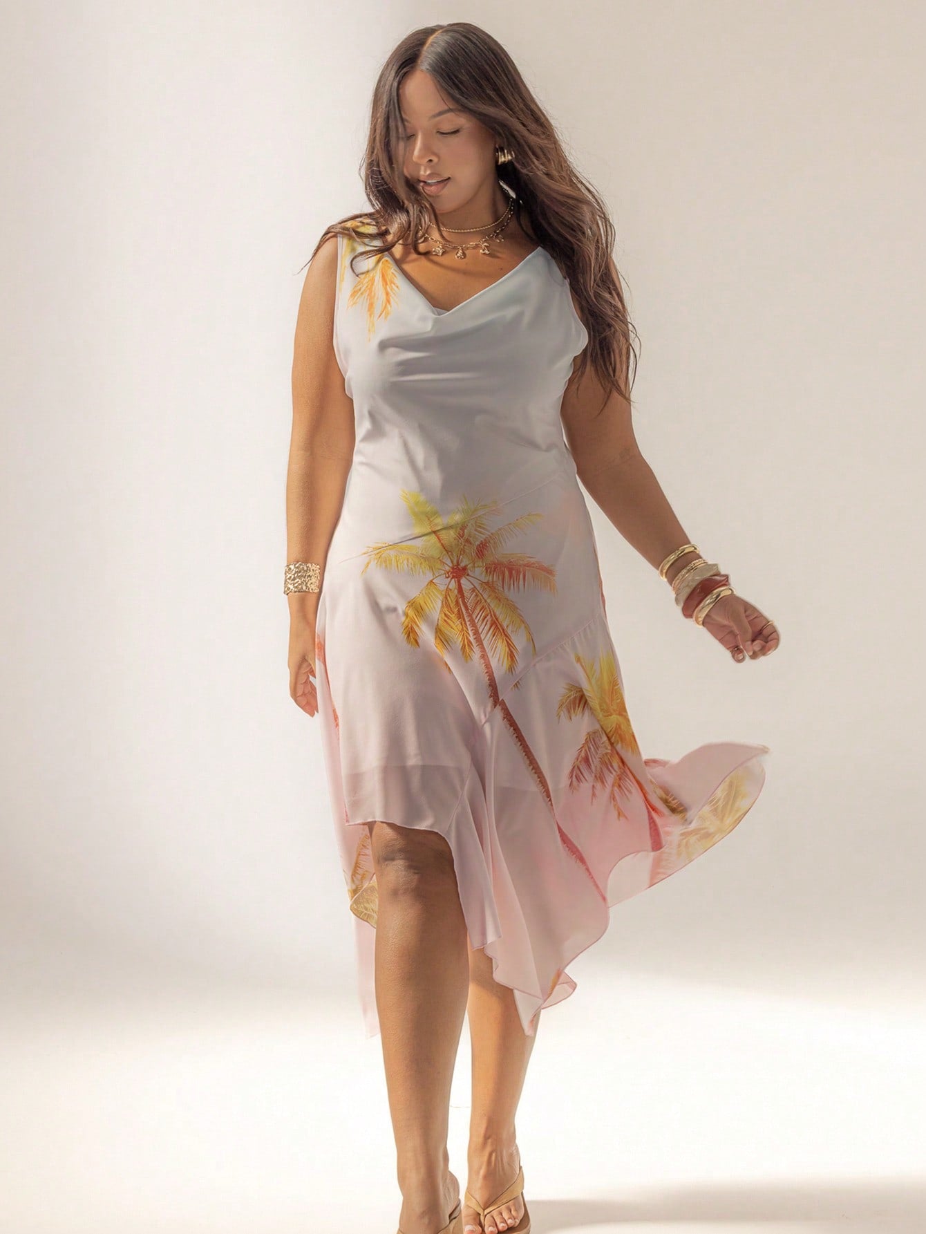 Turn heads on your beach getaway with this Curve Cowl Neck Maxi Dress. Its playful asymmetrical hem flows beautifully with every breeze, while the cowl neck adds a flirty touch. Easy to dress up or down, it’s the perfect companion for sunny days and balmy nights by the shore. Comfortable, stylish, and effortlessly chic—your new vacation favorite awaits!