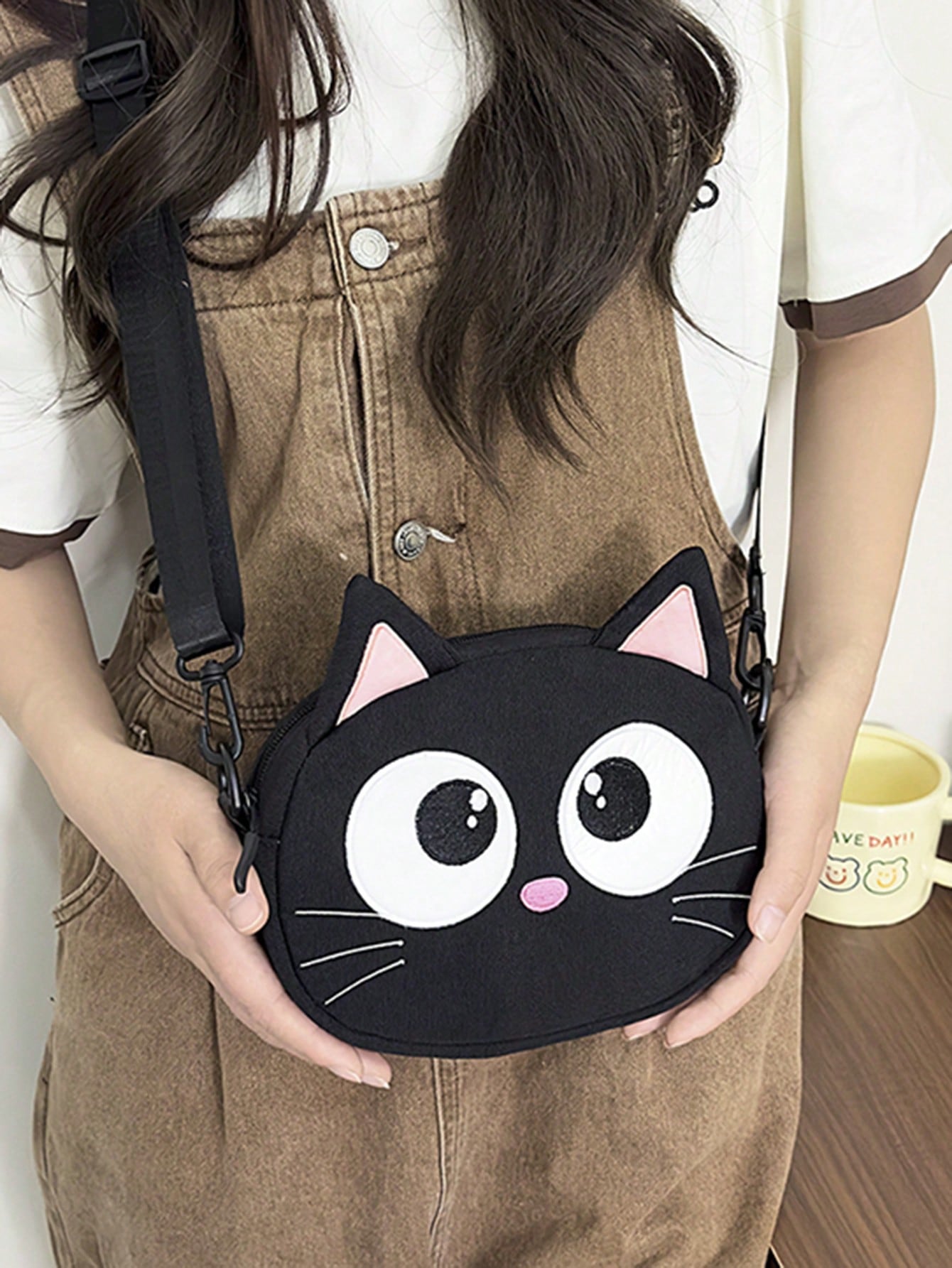 This adorable crossbody bag is perfect for students and casual outings! Featuring a cute embroidered cat design, it's as stylish as it is practical. The canvas material makes it durable and the coin purse adds convenience. (Purrfect for all your essentials!)