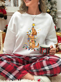 This Cute Puppy Graphic Christmas Sweatshirt for Women is the perfect addition to your festive wardrobe. With its adorable puppy graphic and cozy crew neck, this sweatshirt offers both style and comfort. Made with high-quality materials, it's sure to keep you warm and stylish throughout the holiday season. Order now and spread some holiday cheer!