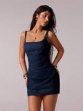 Front three-quarter view of dark indigo fitted denim mini dress with square neck