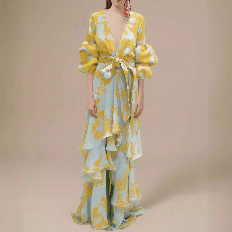 Full front view of pale blue and mustard tropical print belted maxi dress with tiered ruffles