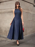 Full front view of dark-indigo sleeveless denim maxi dress with fitted bodice and flared skirt