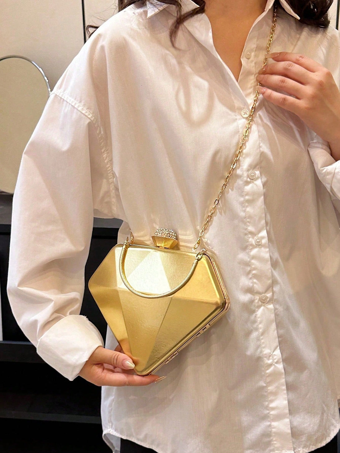 Introducing our Diamond-Shaped Rhinestone Clutch - a stunning evening purse for trendy women with a steampunk-inspired design. This clutch is both stylish and functional, adding a touch of elegance to any outfit. With rhinestone accents and a unique diamond shape, it's perfect for any special occasion. Elevate your style with this must-have accessory!