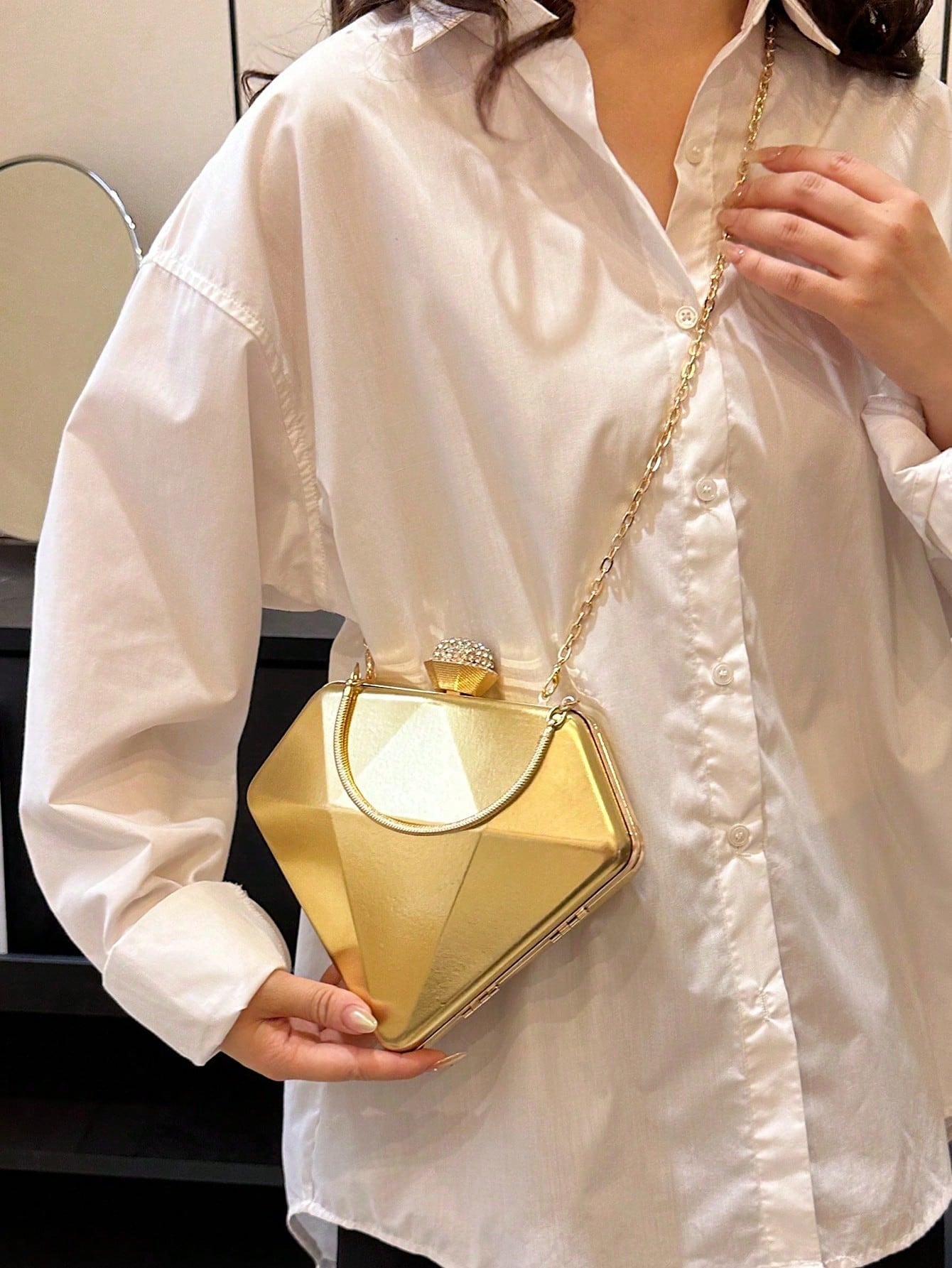 Introducing our Diamond-Shaped Rhinestone Clutch - a stunning evening purse for trendy women with a steampunk-inspired design. This clutch is both stylish and functional, adding a touch of elegance to any outfit. With rhinestone accents and a unique diamond shape, it's perfect for any special occasion. Elevate your style with this must-have accessory!