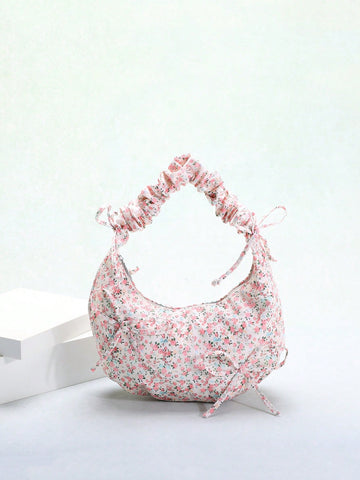 Expertly crafted for both style and convenience, our Ditsy Floral Dumpling Handbag is the perfect addition to any fashion-forward wardrobe. Made in the popular Korean fashion style, this shoulder bag features a beautiful bowknot decoration that adds a touch of elegance to your everyday look. Practical and chic, this handbag is a must-have accessory for any fashion lover.