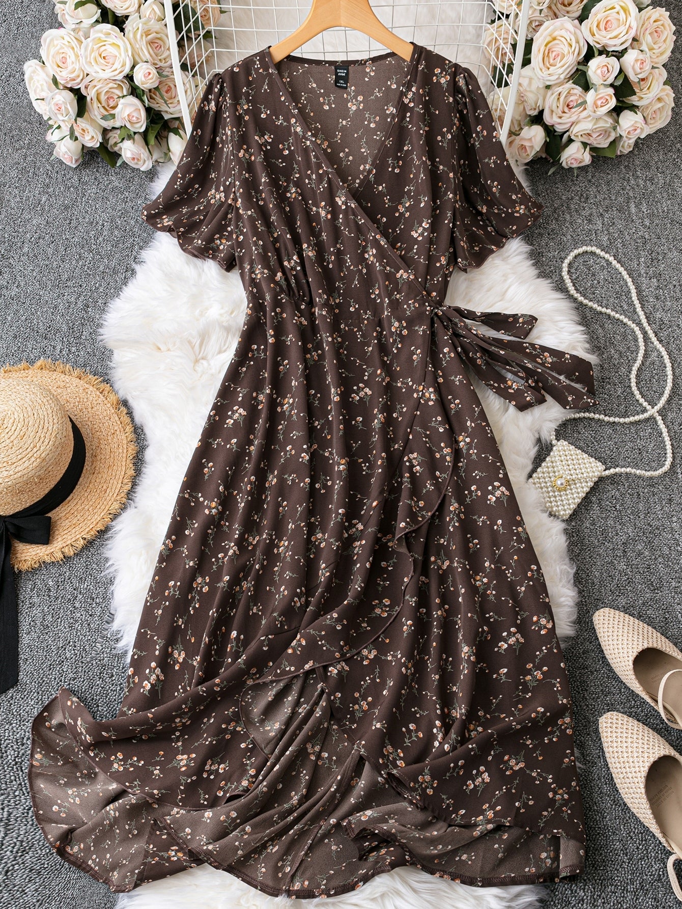 Introducing our Ditsy Floral Print Butterfly Sleeve Maxi Dress! With a playful print and fluttery butterfly sleeves, this dress is perfect for any occasion. The ruffle trim and knot detail add a touch of whimsy to this already charming piece. Get ready to turn heads and make a statement in this dress!