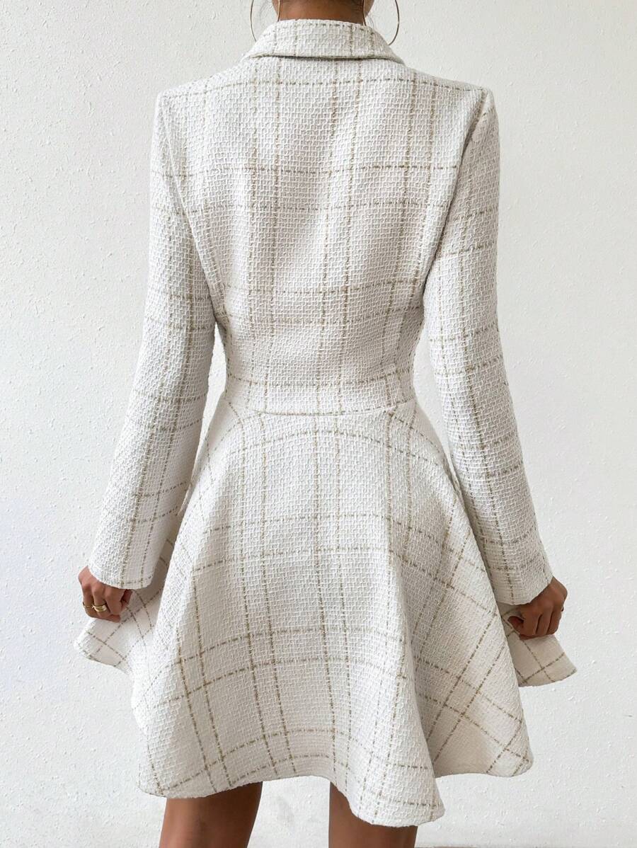 Back view of ivory windowpane plaid blazer mini dress with fitted waist and flared skirt