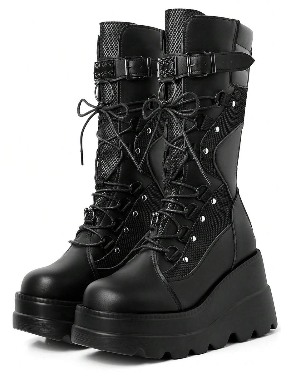 Own the night in these fierce lace-up platform boots that scream rebellion. Studded with gleaming rivets and built for attitude, they're the ultimate statement piece for anyone who refuses to blend in. Whether you're hitting the club, cruising on two wheels, or just living your darkest fantasy, these boots deliver serious edge with every stomp. Comfortable enough to wear all night, bold enough to turn heads—because conformity is so last season.