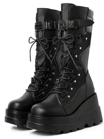Own the night in these fierce lace-up platform boots that scream rebellion. Studded with gleaming rivets and built for attitude, they're the ultimate statement piece for anyone who refuses to blend in. Whether you're hitting the club, cruising on two wheels, or just living your darkest fantasy, these boots deliver serious edge with every stomp. Comfortable enough to wear all night, bold enough to turn heads—because conformity is so last season.