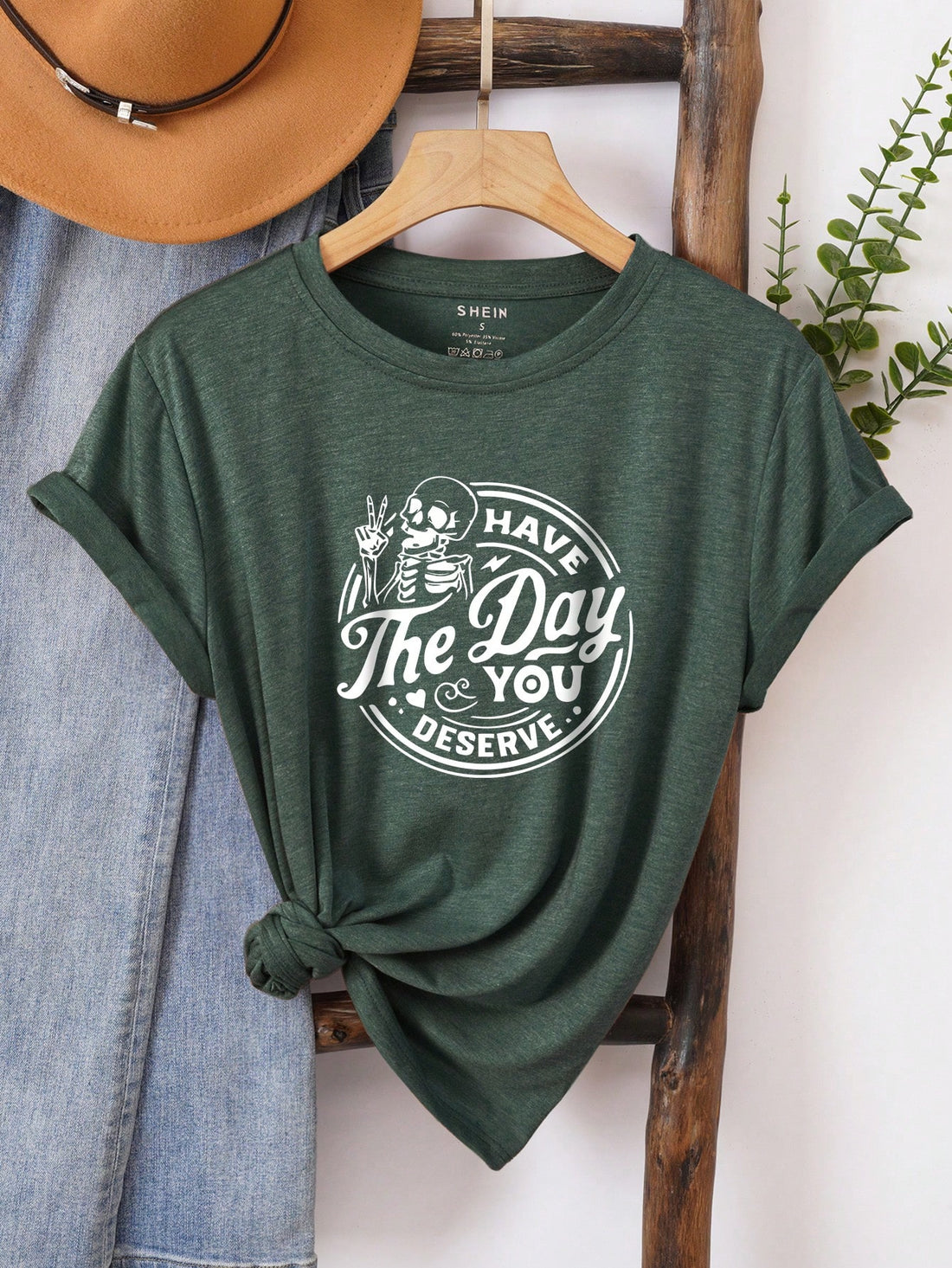 Embrace your inner edgy fashionista with this skeleton slogan graphic tee. Let your unique style shine with this playful and quirky shirt that shows off your fun, unapologetic personality. Dare to stand out and make a statement with this must-have addition to your wardrobe.