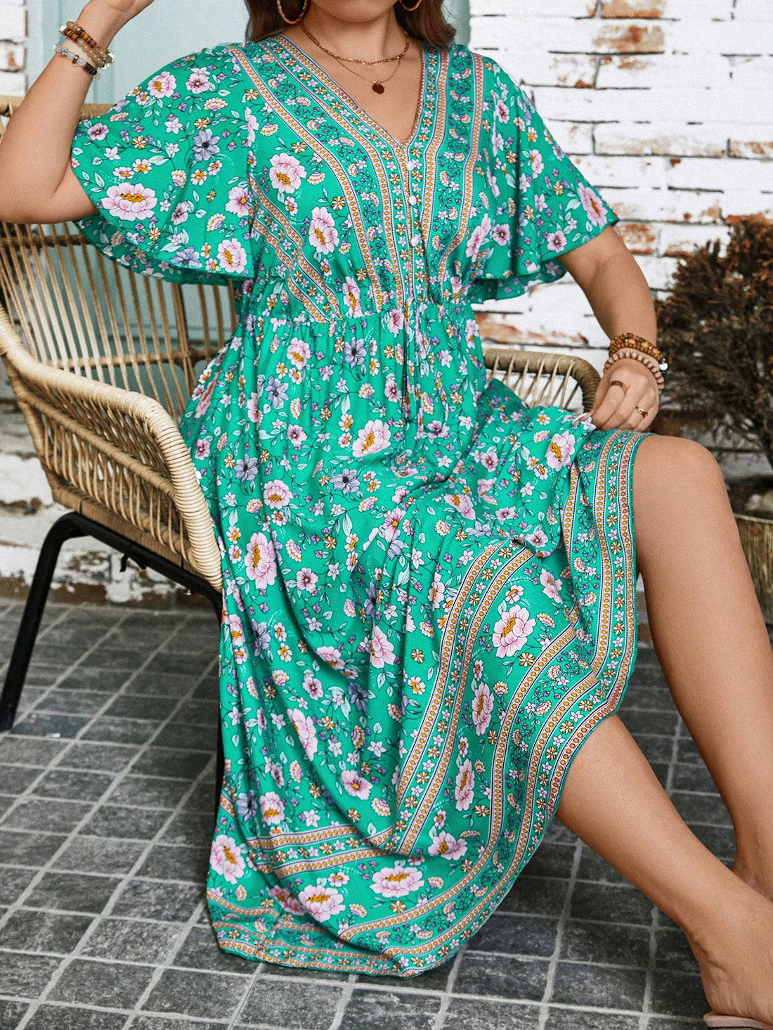 Get ready to turn heads in our Effortless Elegance dress! Featuring a playful floral print, flattering V-neck, and flirty ruffle hem, this plus size dress is perfect for summer. Bring on the compliments!