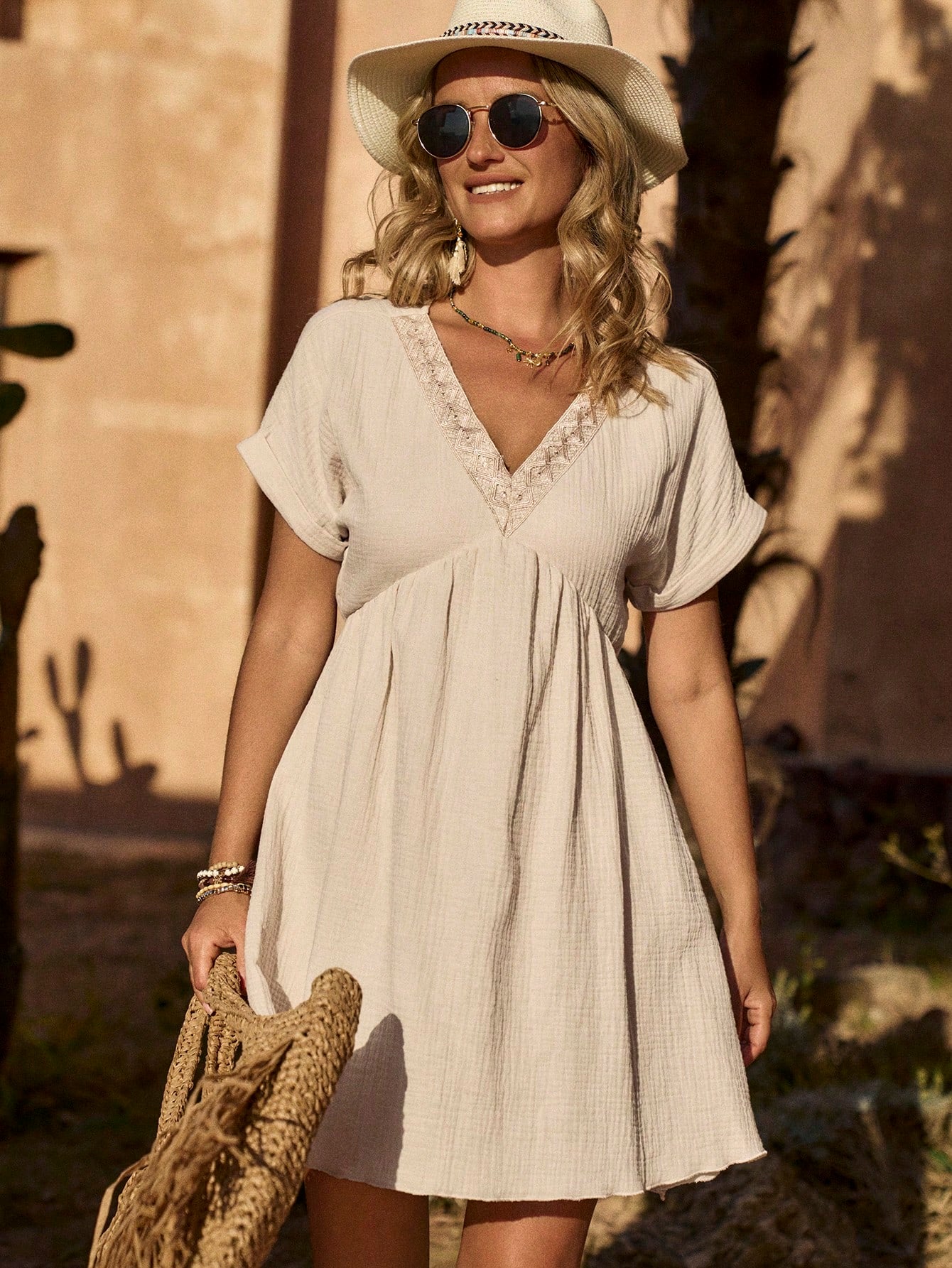 Introducing the perfect blend of effortless elegance and playful vacation vibes with our V-Neck Ruffle Trim Dress. This must-have piece for Spring/Summer will have you feeling fabulous and carefree. With its flattering silhouette and trendy ruffle accents, this dress is the perfect choice for any casual occasion. (Effortless style, playful vacation vibes, flattering silhouette, trendy ruffle accents.)